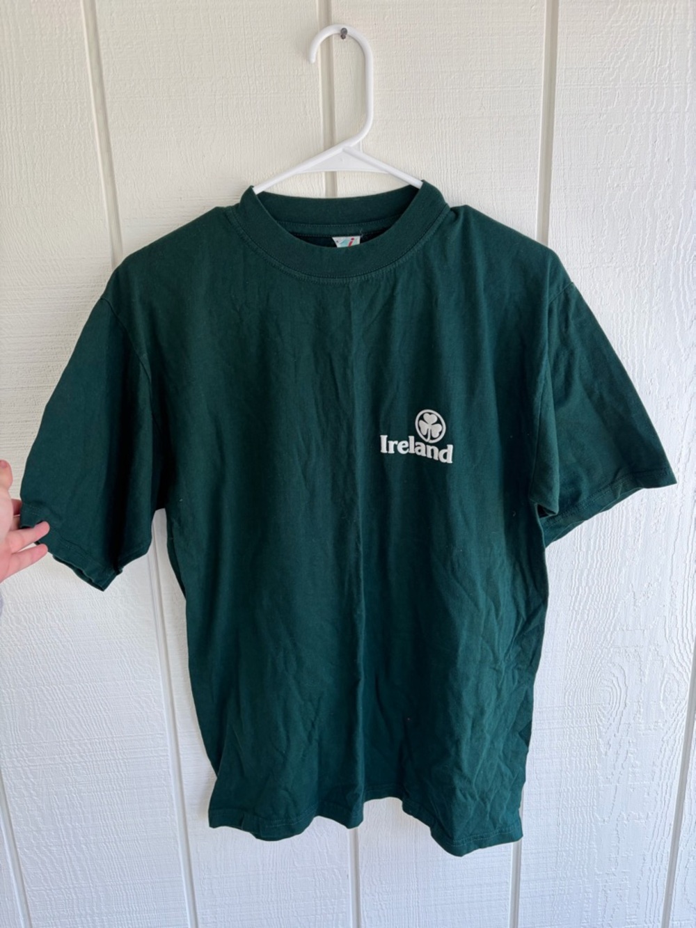 Classic forest green crewneck tee with logo tag